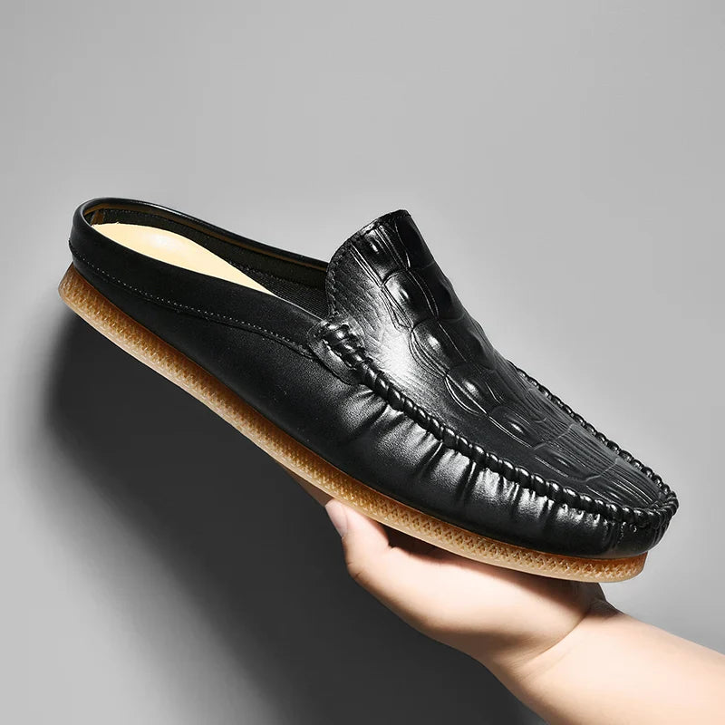 Gianni backless slide loafers showcasing embossed upper and classic moc toe, perfect for daily wear and comfort.
