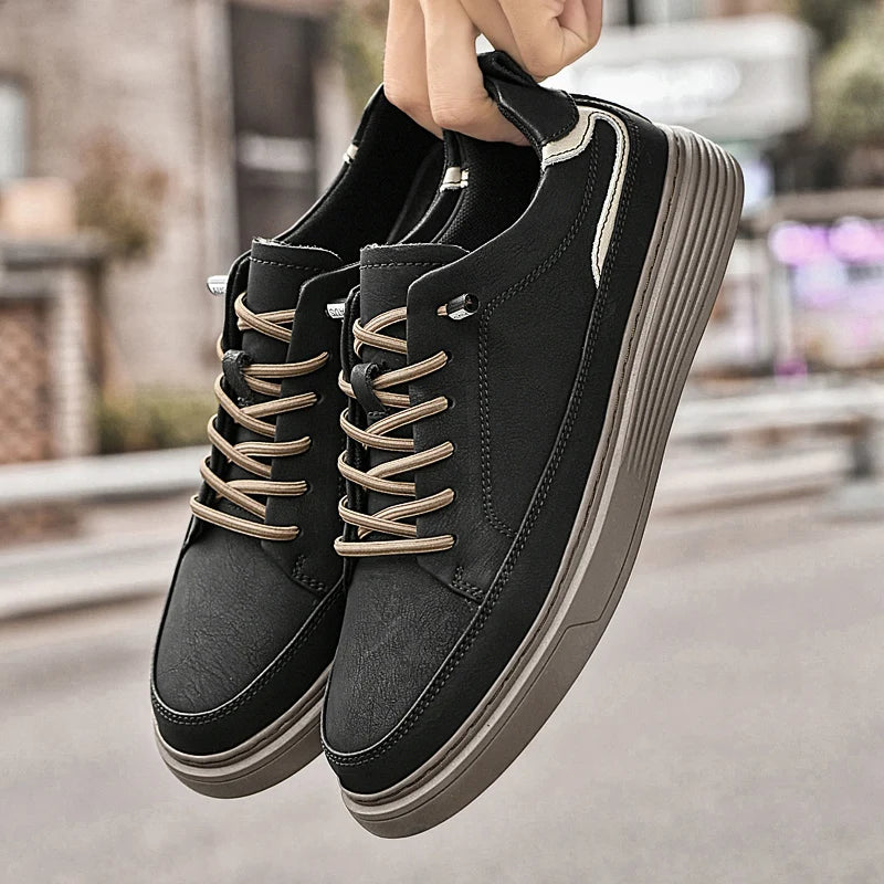 Genesis Leather Sneakers in black with lace-up design, cushioned interior, and durable rubber sole for comfort and style.