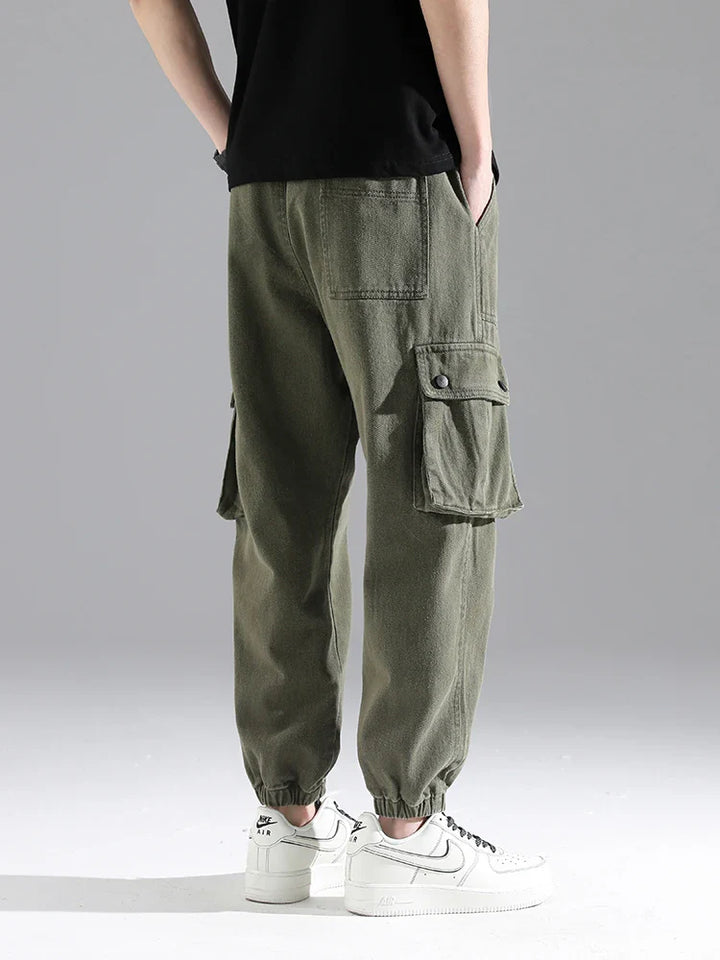 Lennox Cargo Joggers featuring heavyweight cotton blend, reinforced seams, oversized pockets, and elastic cuffs.