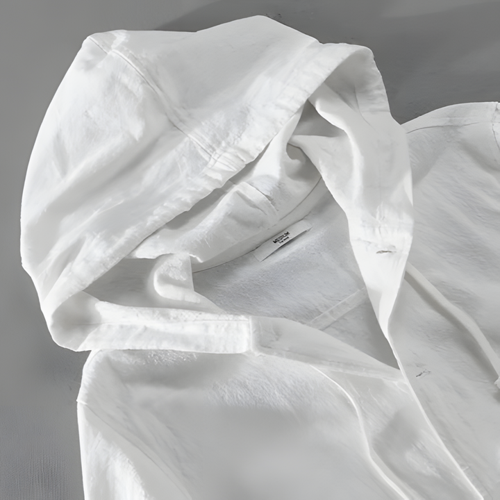Element Linen Hoodie with roomy hood, adjustable drawstring, and front button closure, showcasing a premium linen-cotton blend.