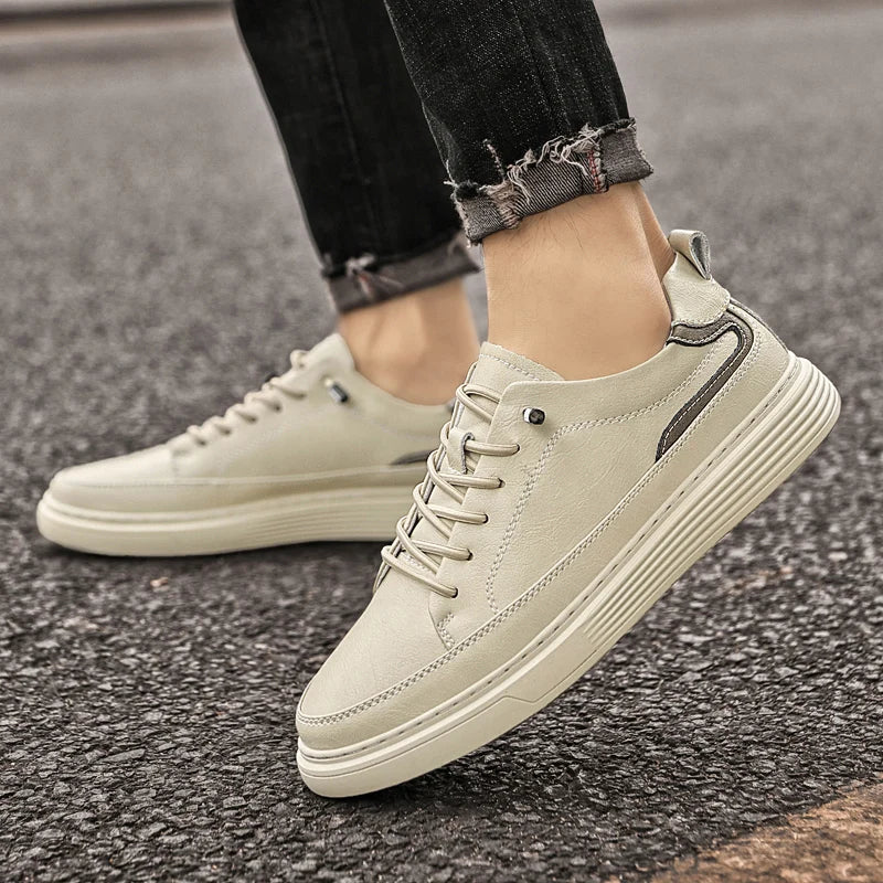 Genesis Leather Sneakers in beige, featuring a cushioned interior and durable rubber sole for everyday comfort.