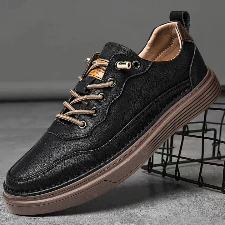 Alvo Genuine Leather Sneakers in black, featuring artisanal hand-stitched details and a cushioned sole for everyday comfort.
