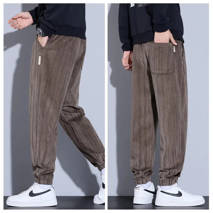 Riden Checkered Corduroy Pants showcasing tapered fit, brushed interior, and sleek design in brown with cuffed ankles.