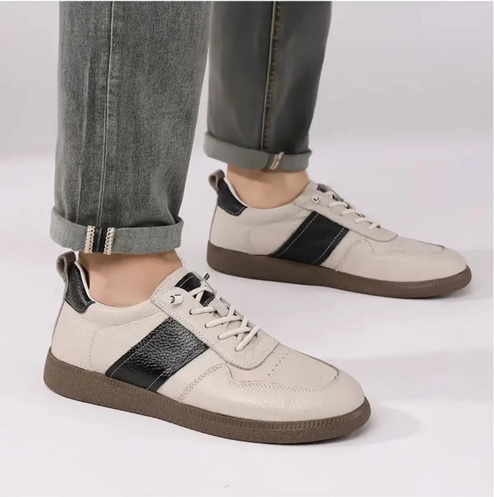 Axel Street Comfort Sneakers in beige with contrasting black side panels, showcasing style and comfort for everyday wear.