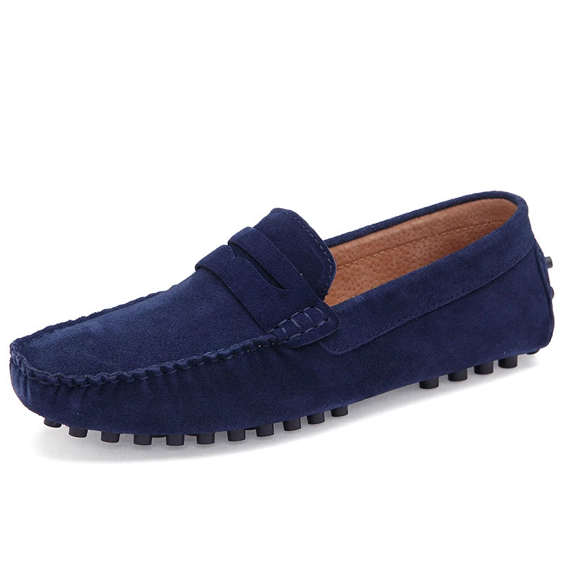 Navy Grazia suede loafers with precision hand-stitching and textured rubber sole for optimal grip and style.