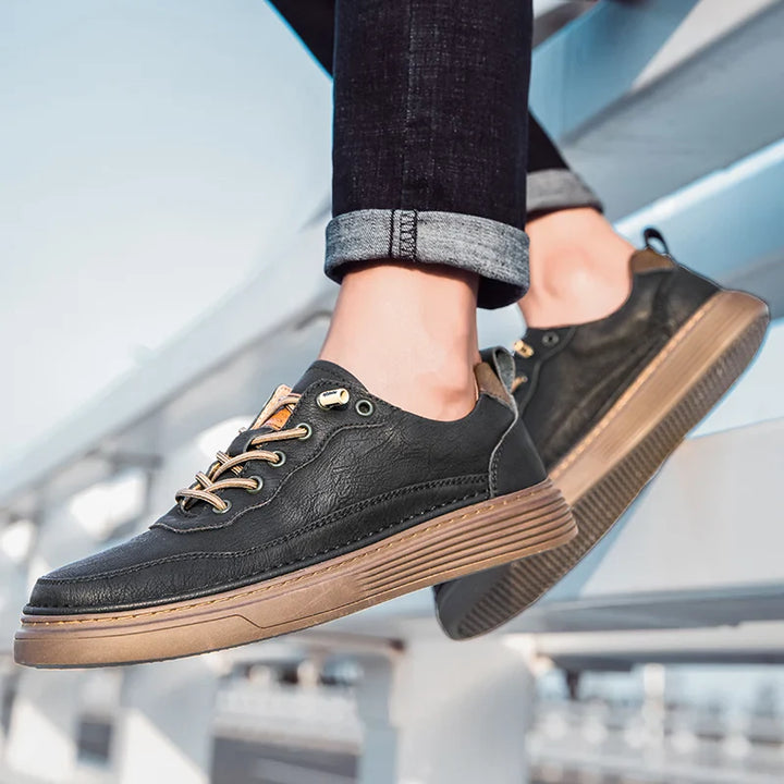 Alvo Genuine Leather Sneakers in black, featuring hand-stitched details and a comfortable sole, ideal for everyday wear.