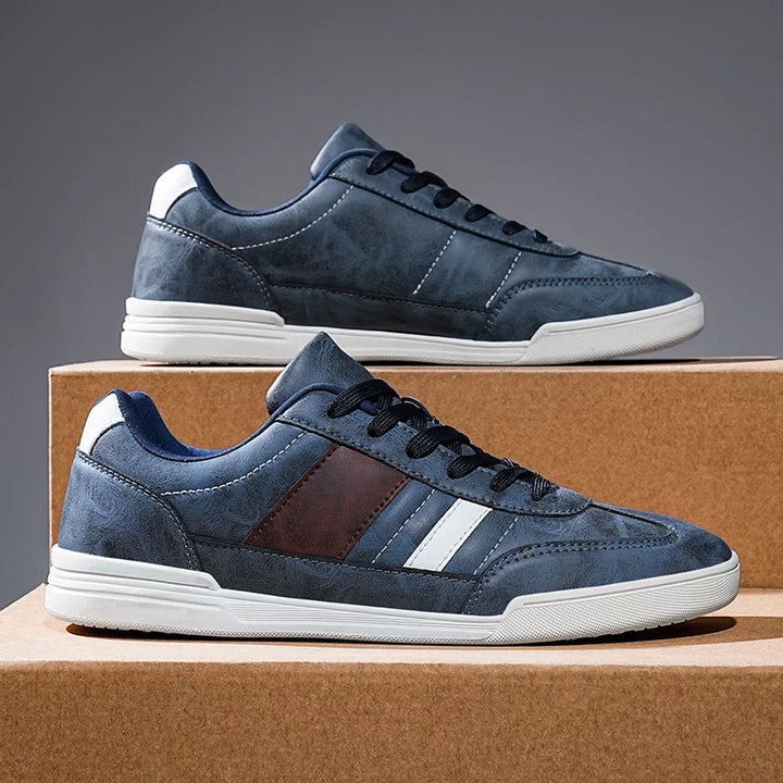 Rival Sport Sneakers featuring retro-inspired design with contrast paneling on stylish low-profile silhouette.