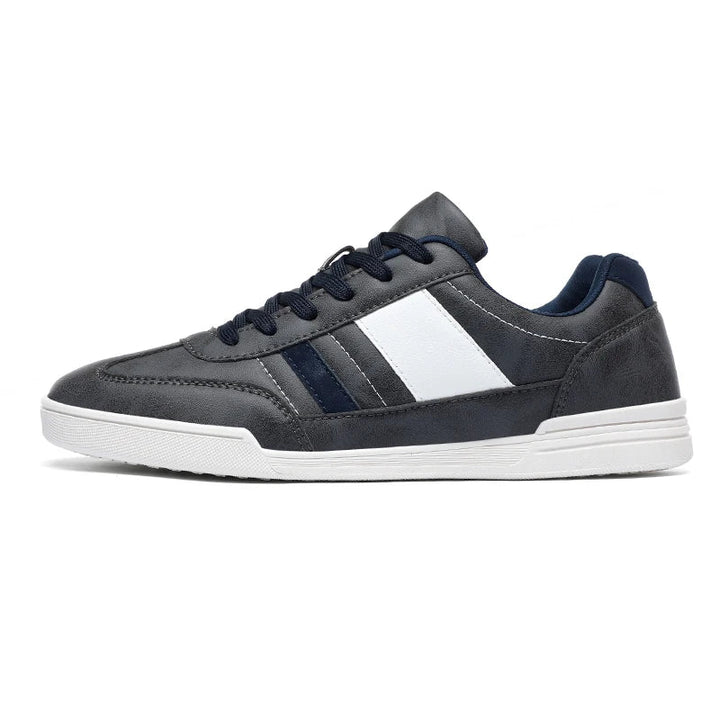 Rival Sport Sneakers featuring a sleek low-profile design and bold contrast paneling in gray and navy.