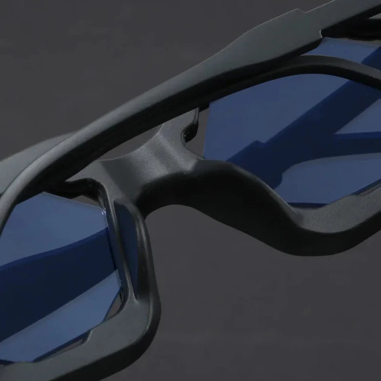 Close-up of Vantor Sunglasses featuring a sharp geometric frame and blue lenses for stylish UV400 protection.