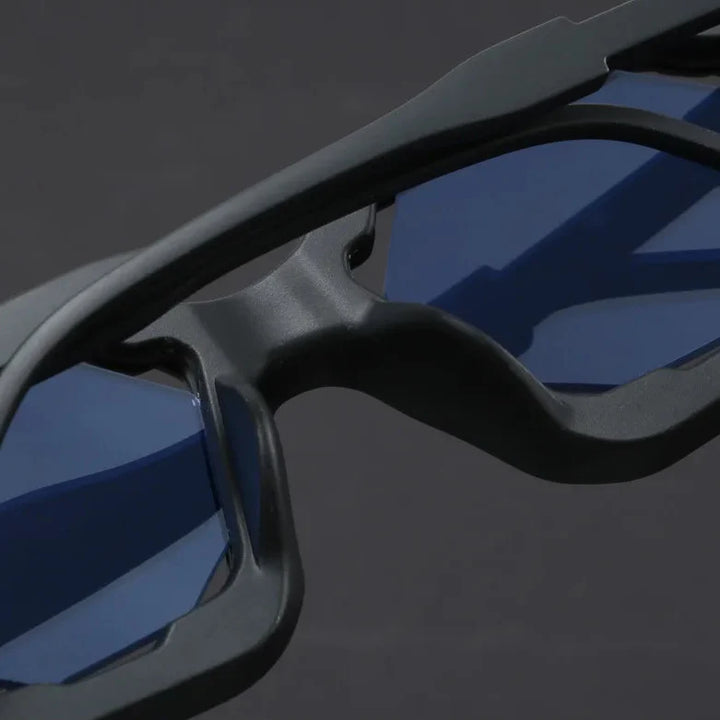 Close-up of Vantor Sunglasses featuring a sharp geometric frame and blue lenses for stylish UV400 protection.