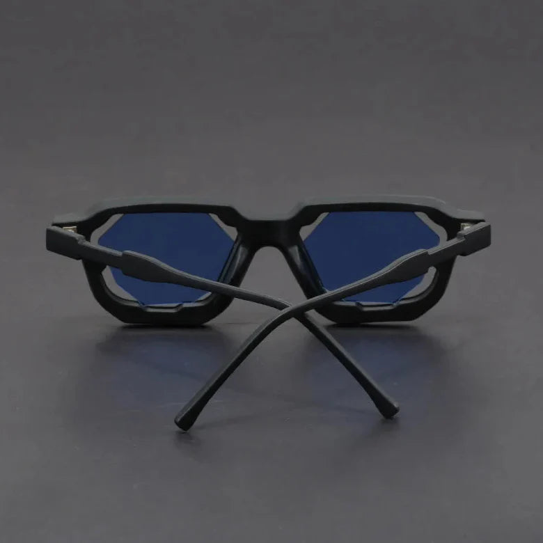 Vantor sunglasses featuring a sharp geometric frame and bold sculpted edges with blue lenses.