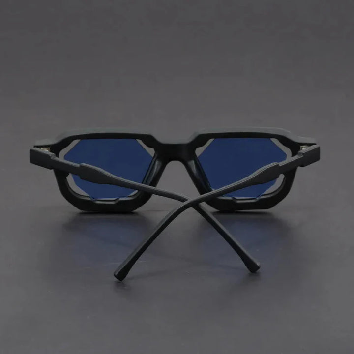 Vantor sunglasses featuring a sharp geometric frame and bold sculpted edges with blue lenses.