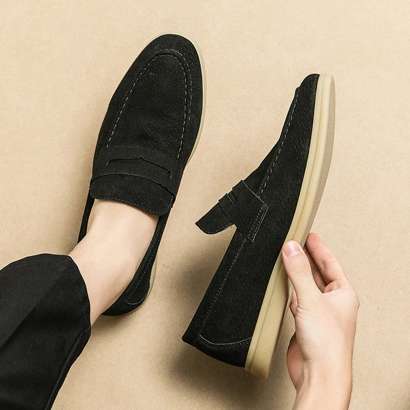 Levor Men's Suede Loafers in black, featuring a sculptural strap and lightweight sole, embodying style and comfort.