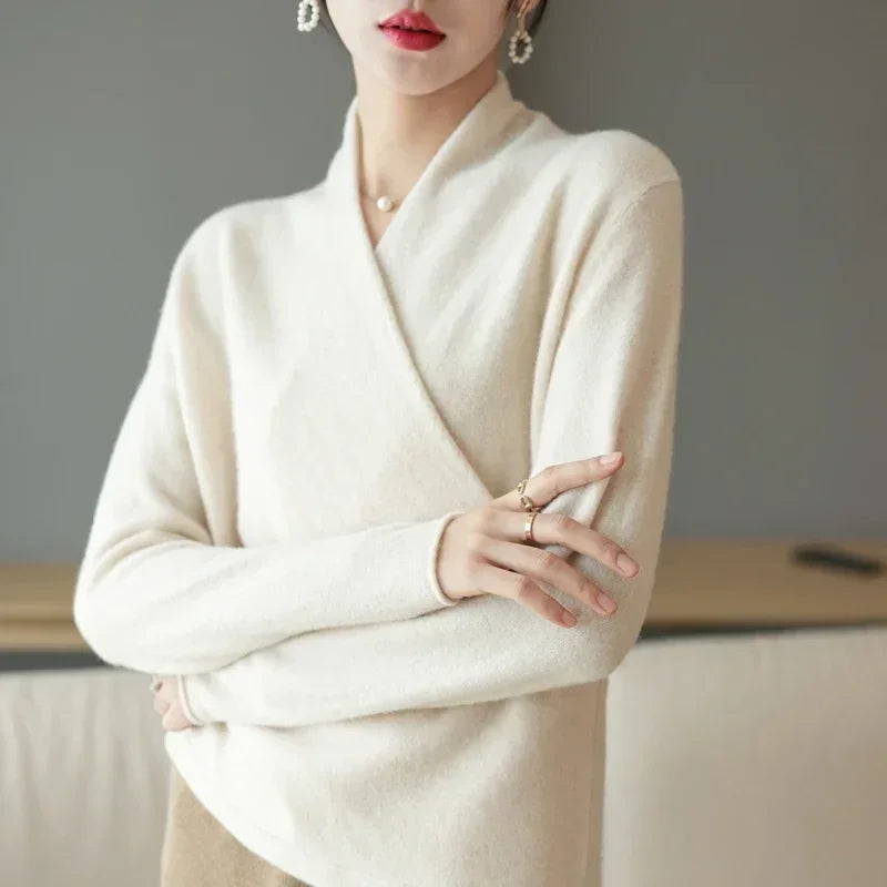 Elegant wrap-front wool sweater in soft beige, showcasing a relaxed fit and luxurious comfort for any occasion.
