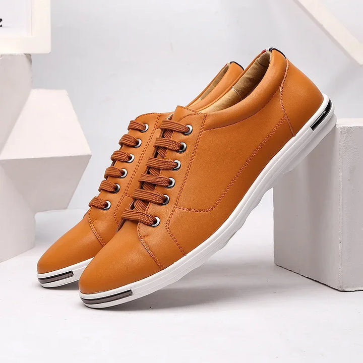 Paxton Low-Top Comfort Sneakers in tan leather with hidden lacing, featuring plush insoles for all-day ease.