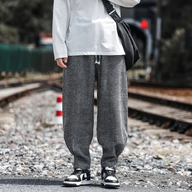 Oslo Textured Joggers featuring a relaxed fit and adjustable drawstring waist, styled with a casual long sleeve shirt.