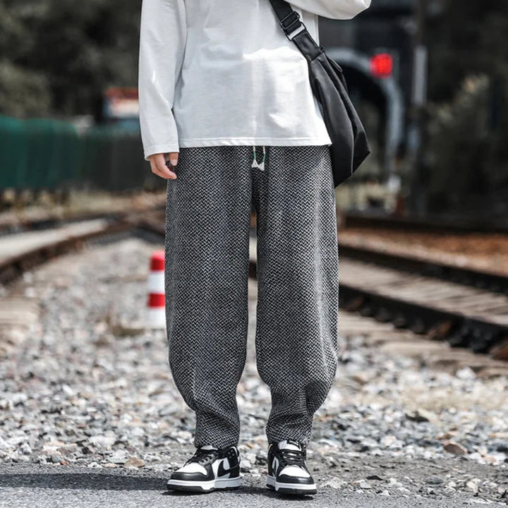 Oslo Textured Joggers featuring a relaxed fit and adjustable drawstring waist, styled with a casual long sleeve shirt.