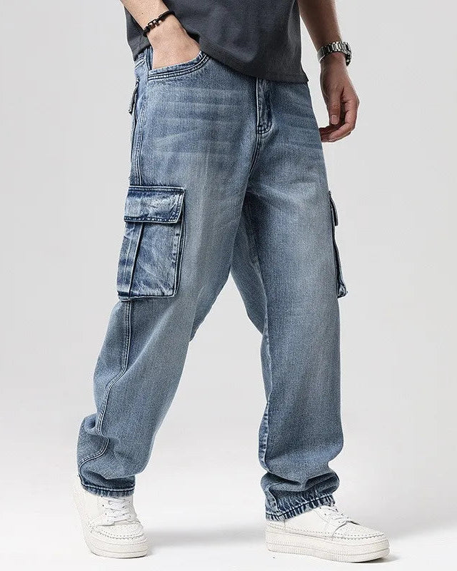 Ryder Washed Cargo Jeans featuring heavyweight cotton, oversized pockets, and relaxed wide-leg fit in a stylish blue wash.