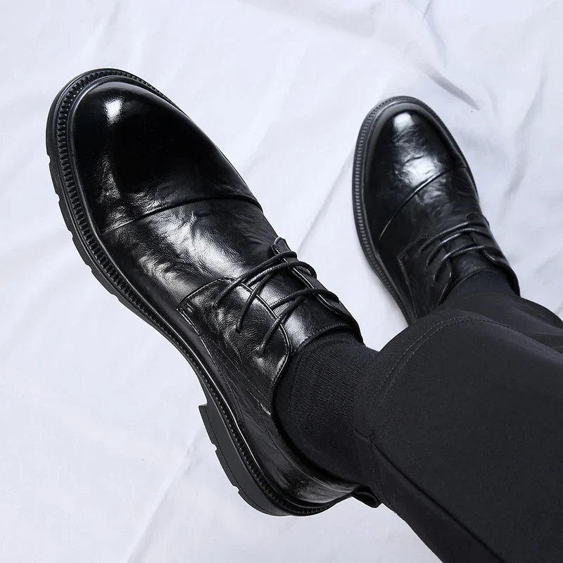 Soren genuine leather shoes showcasing a polished black finish, lace-up design, and durable rubber sole for everyday comfort.