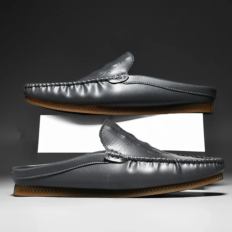 Gianni Backless Slide Loafers showing embossed upper and classic moc toe design for stylish comfort.