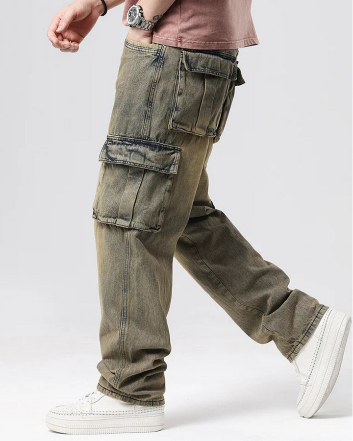 Model showcasing Ryder Washed Cargo Jeans featuring oversized pockets and relaxed wide-leg fit in a stylish design.