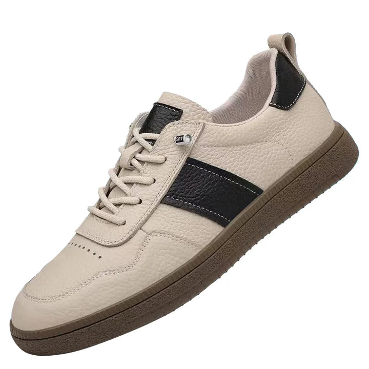Axel Street Comfort Sneakers in beige leather with black side panel and cushioned sole, perfect for all-day wear.
