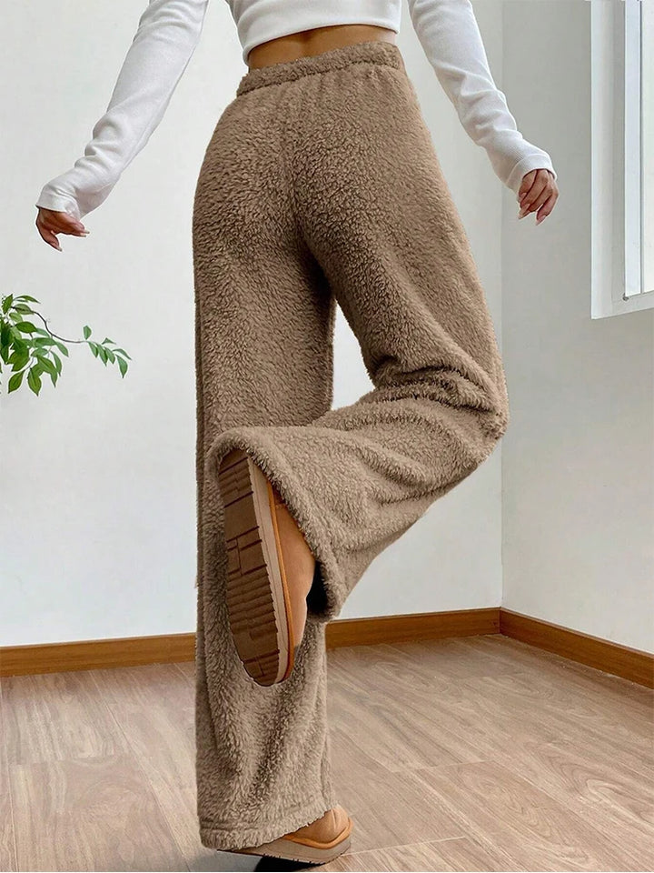 Back view of Sherpa Flow Sweatpants in soft fluffy texture, featuring a relaxed wide-leg fit and adjustable drawstring waist.
