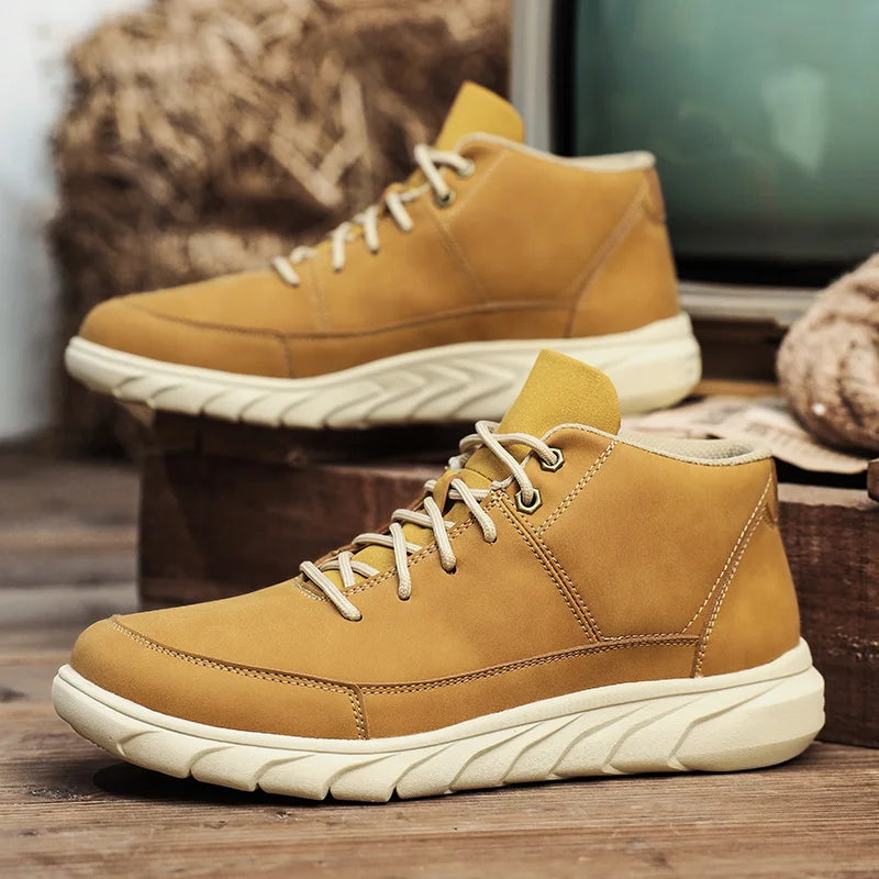 Summit Leather Mid-Tops in light brown, featuring a cushioned sole, lace-up design, and mid-top style for comfort and durability.