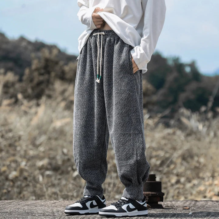 Oslo Textured Joggers feature a relaxed fit, adjustable drawstring waist, and breathable fabric, styled with a casual top.