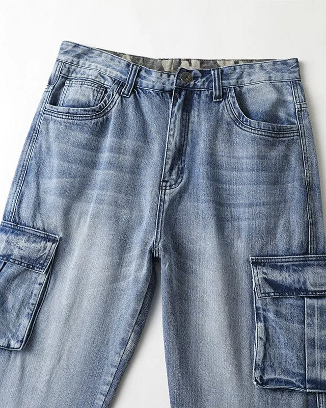 Ryder Washed Cargo Jeans featuring heavyweight cotton, oversized pockets, and relaxed wide-leg fit in a faded blue wash.