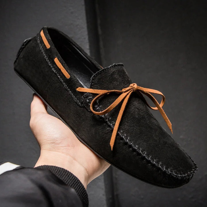 Monte Carlo genuine suede loafers featuring hand-stitched craftsmanship and premium leather laces for comfort and style.