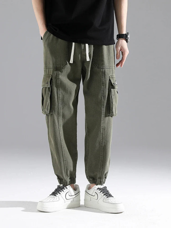 Lennox Cargo Joggers in olive green featuring reinforced seams and oversized snap pockets for a stylish and functional look.