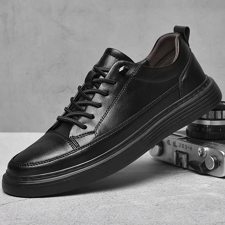 Aristo Oxford Shoes: Black genuine leather low-top sneakers with bold laces and cushioned sole for casual or formal wear.