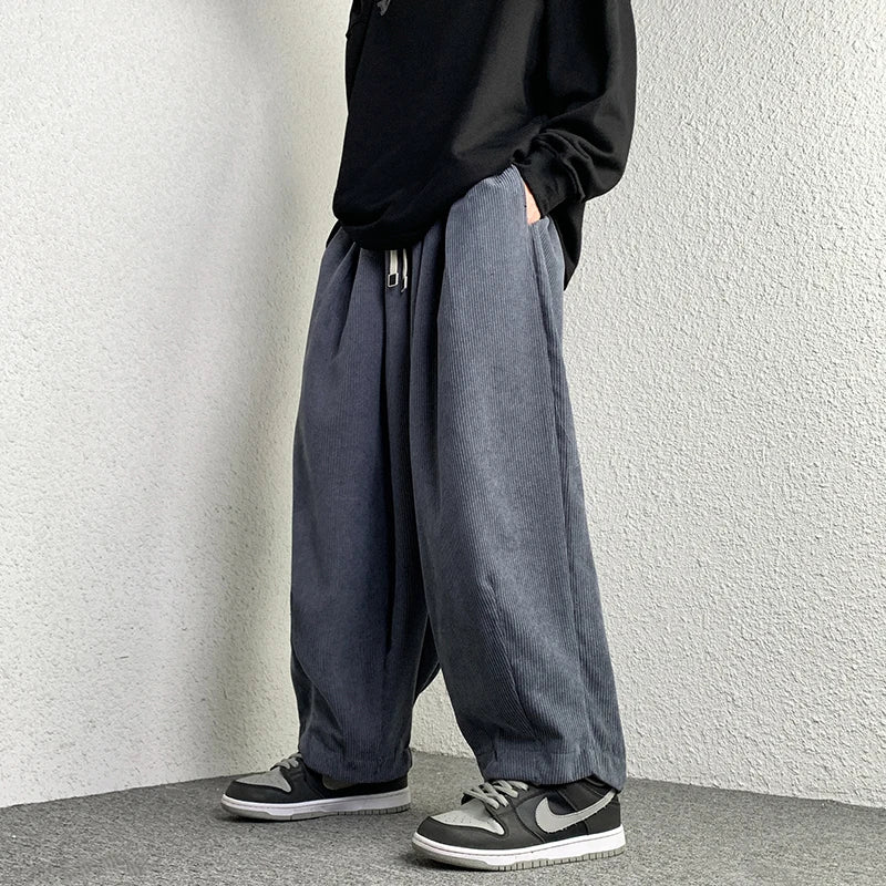 Arlo corduroy pants featuring a wide-leg fit, adjustable drawstring waist, and deep pockets in a relaxed style.