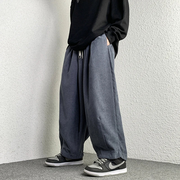 Arlo corduroy pants featuring a wide-leg fit, adjustable drawstring waist, and deep pockets in a relaxed style.