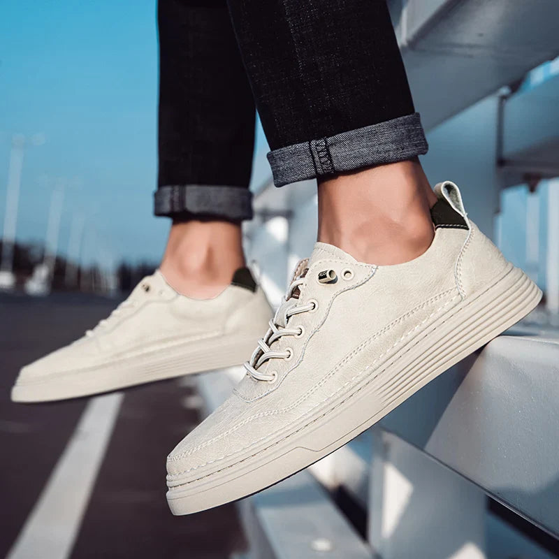 Alvo Genuine Leather Sneakers in beige, showcasing artisanal hand-stitched details and a comfortable fit.