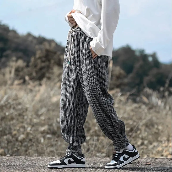 Oslo textured joggers with adjustable drawstring waist, tapered cuffs, and stylish sneaker pair outdoor