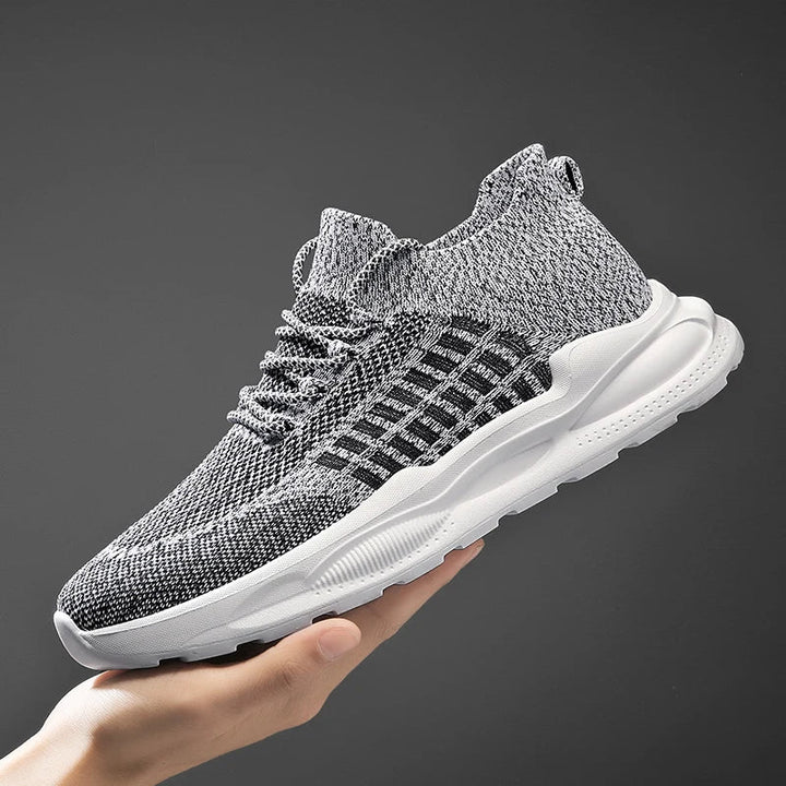 Brava Performance Mesh Sneaker in black and white, featuring breathable knit and high-rebound midsole for running.
