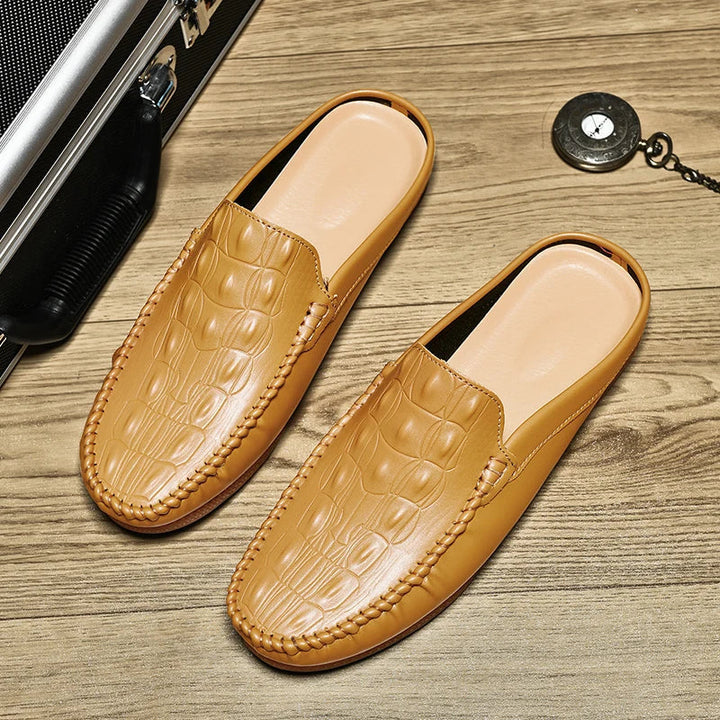 Gianni Backless Slide Loafers in tan with embossed upper, designed for comfort and effortless slip-on style.