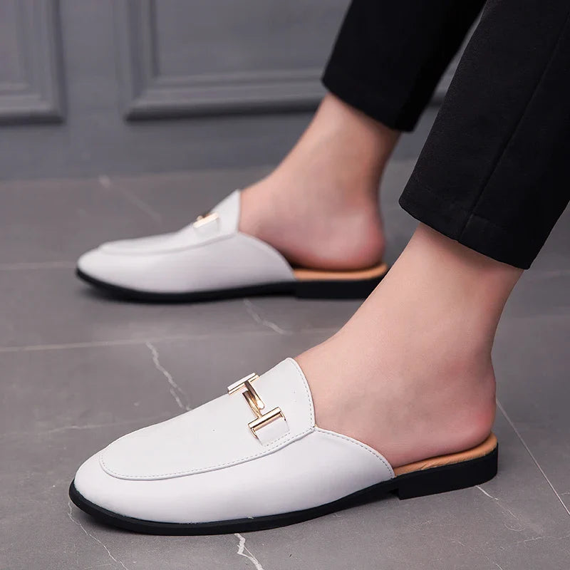 Santino Backless Slide Loafers featuring a sleek white design and gold bit hardware for a stylish look.