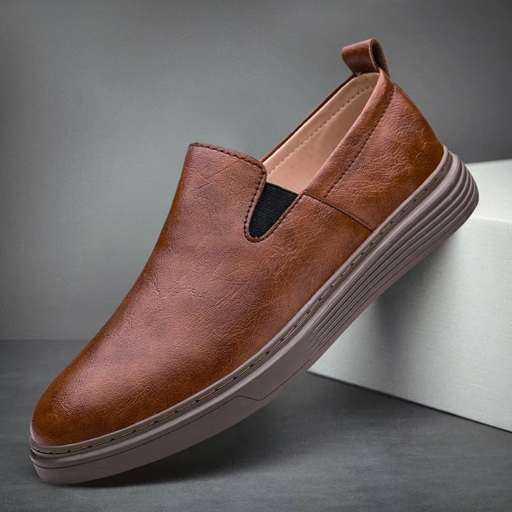 Duke Leather Slip-On Shoes in brown with cushioned sole and elastic side panels for easy wear.