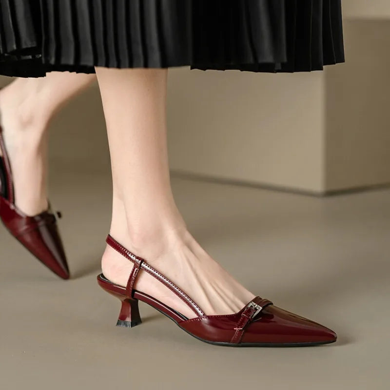 Sleek burgundy shine point slingback heels with a flared mid-heel, perfect for stylish comfort on any occasion.