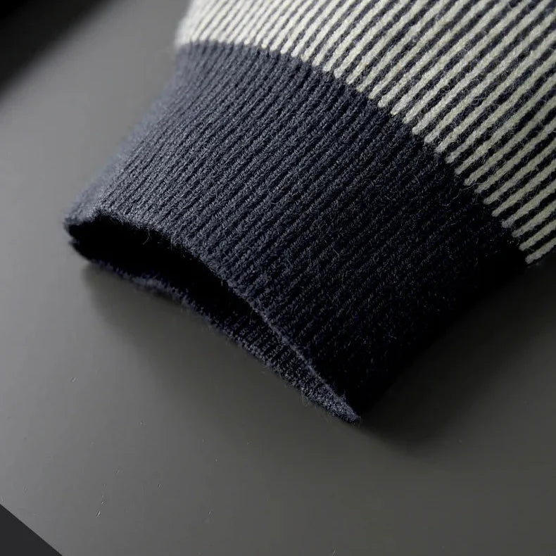 Close-up of the ribbed contrast sleeve of the Rowan Merino Cardigan, showcasing its soft texture and quality.