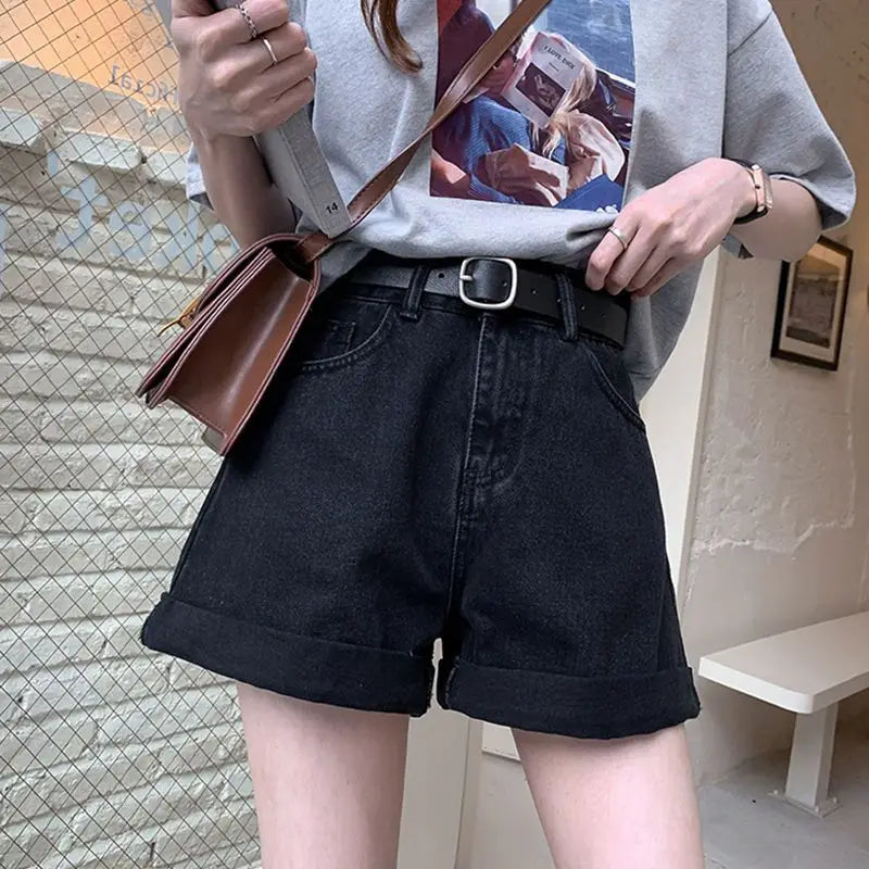 High-waisted Sienna Retro Denim Shorts in black, featuring cuffed hems and vintage-style stitching for a stylish Y2K look.