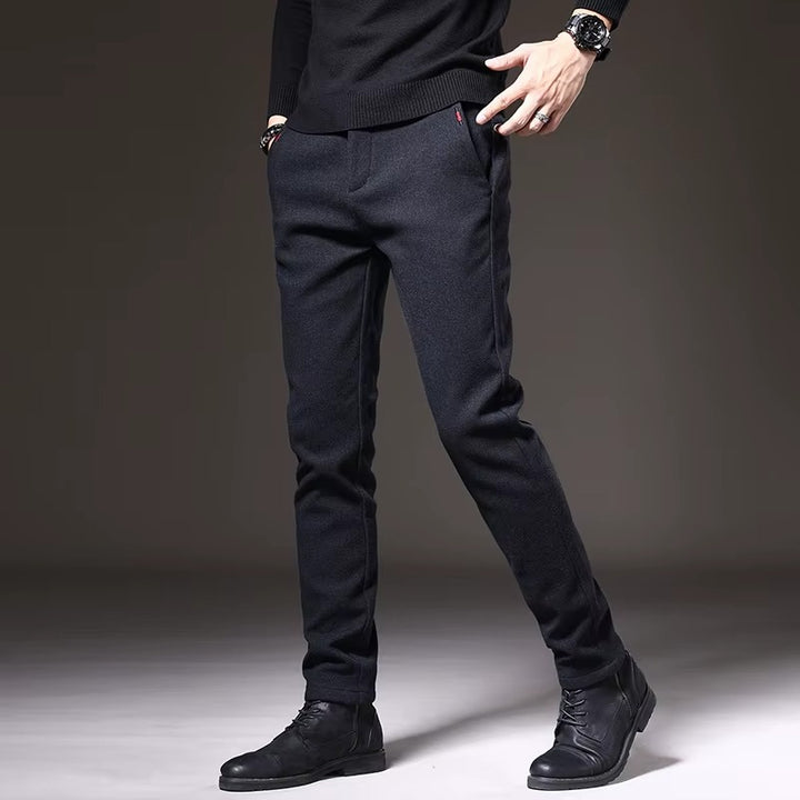 Henderson slim-fit pants in dark color, featuring a modern tailored look, perfect for casual and polished occasions.
