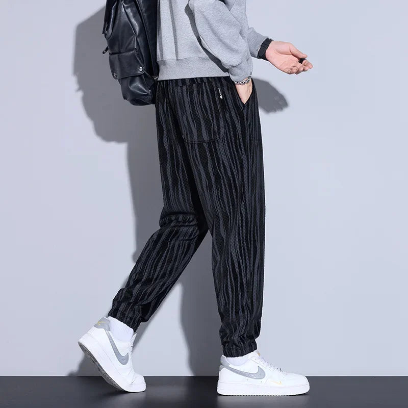 Model wearing Riden Checkered Corduroy Pants with a tapered fit, showcasing bold texture and comfort.