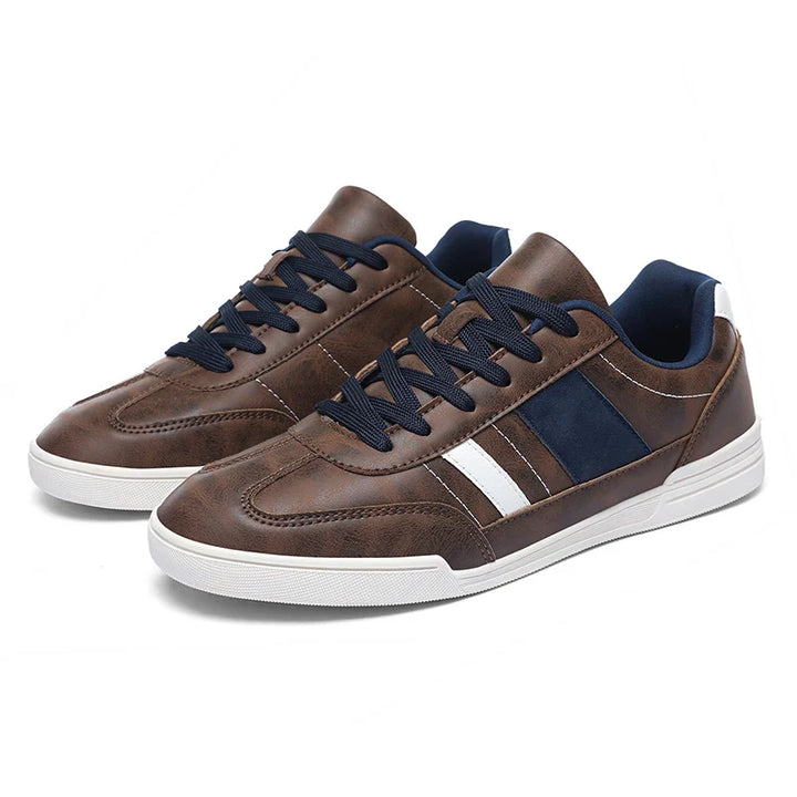 Rival Sport Sneakers featuring brown leather, striking contrast paneling, and a low-profile silhouette for versatile style.