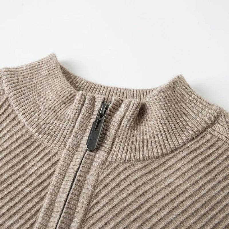 Close-up of Windsor Quarter-Zip sweater showing textured knit and zipper design in a neutral beige color.