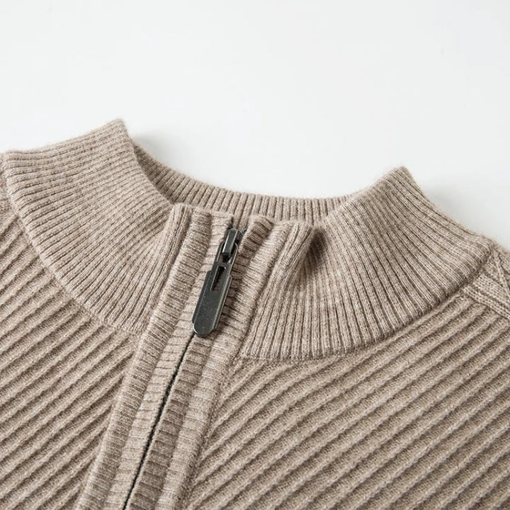 Close-up of Windsor Quarter-Zip sweater showing textured knit and zipper design in a neutral beige color.