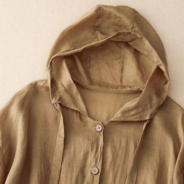 Calypso Coast Linen Hoodie featuring a soft cotton-linen blend, button-up front, and airy hood for lightweight sun protection.
